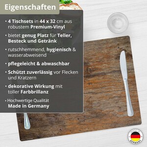 May include: Set of four brown wood-look placemats with a grey text description. The text reads: "4 Tischsets in 44 x 32 cm aus robustem Premium-Vinyl bietet genug Platz f&uuml;r Teller, Besteck und Getr&auml;nk rutschhemmend, hygienisch & wasserabweisend pflegeleicht & abwaschbar Sch&uuml;tzt zuverl&auml;ssig vor Flecken und Kratzern dekorative Wirkung mit toller Farbbrillanz Hochwertige Qualit&auml;t Made in Germany".