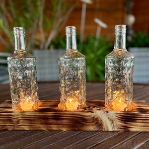 Table lamp three-flame with old Three Sixty Vodka bottles - glass on wood - special unique piece on squared timber - commissioned work