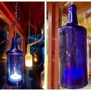 Lantern made from an Italian water bottle - a bottle boy with glass relief - special unique piece with wire insert