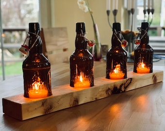 Table candlestick with old beer bottles - glass on wood - special unique piece on roof battens or squared timber - commissioned work