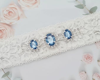 Garter with blue rhinestone