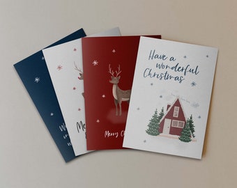 Könnte beinhalten: Vier Weihnachtskarten mit verschiedenen Designs. Die erste Karte ist blau mit weißen Schneeflocken und dem Text "We wish you a merry Christmas". Die zweite Karte ist weiß mit roten Schneeflocken und einem roten Rentier. Die dritte Karte ist rot mit weißen Schneeflocken und einem braunen Rentier. Die vierte Karte ist weiß mit blauen Schneeflocken und einem roten Häuschen mit weißem Dach und dem Text "Have a wonderful Christmas".