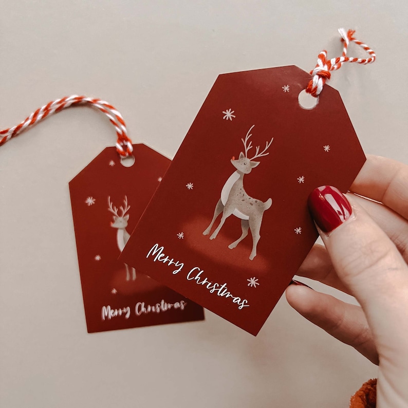 Matching gift tags with an illustrated reindeer and Merry Christmas written on it