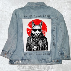 May include: Light blue denim jacket with a graphic of a fox wearing sunglasses and a leather jacket, set against a red circle. The graphic measures 12.6 inches wide, 14.2 inches tall, and 10.2 inches long.