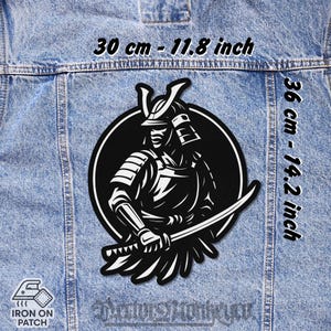 May include: Black and white iron-on patch featuring a detailed illustration of a samurai warrior holding a katana. The patch is 11.8 inches wide and 14.2 inches tall. The text "IRON ON PATCH" is visible. The patch is on a denim jacket.