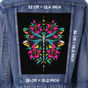 May include: A blue denim jacket featuring a large rectangular patch on the back with a colorful dragonfly and floral graphic. The patch measures 12.6 inches wide by 14.2 inches high, with a bottom width of 10.2 inches, printed in pink, blue, and yellow.