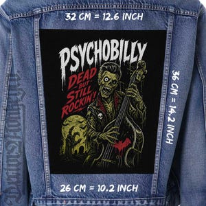 May include: A denim jacket with a large, rectangular patch. The patch features a zombie playing a stand-up bass, with the words "PSYCHOBILLY" and "DEAD BUT STILL ROCKIN'!" The patch measures 12.6 inches by 14.2 inches.