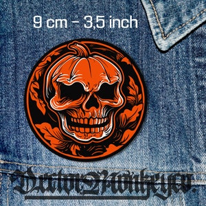 May include: Orange and black Halloween patch with a skull inside a pumpkin. The patch is 3.5 inches in diameter.
