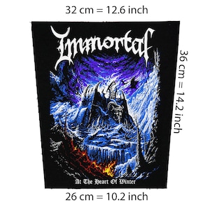 May include: Black patch, 12.6 inches wide by 14.2 inches tall, featuring the band name "Immortal" in white gothic lettering. The design includes a dark castle scene with a horned figure, set against a purple and blue sky. The text "At The Heart Of Winter" is at the bottom.