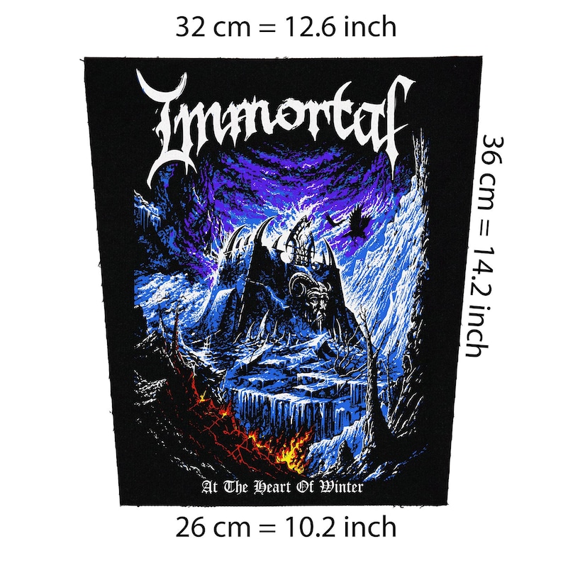 May include: Black patch, 12.6 inches wide by 14.2 inches tall, featuring the band name "Immortal" in white gothic lettering. The design includes a dark castle scene with a horned figure, set against a purple and blue sky. The text "At The Heart Of Winter" is at the bottom.