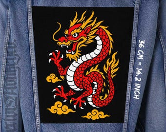 May include: A denim jacket with a large black patch featuring a red and yellow dragon design. The dragon is detailed with white accents and sits above yellow cloud shapes. The patch measures 32 cm wide, 36 cm high, and 26 cm across.