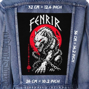 May include: A blue denim jacket featuring a large rectangular back patch with a black background, a red circular sun, and a white wolf illustration with chains. The text FENRIR is printed above. Dimensions are 12.6 inches wide by 14.2 inches high.