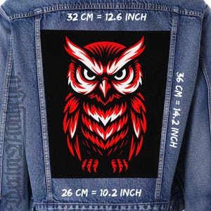 May include: A denim jacket with a large, rectangular patch featuring a red and white owl design. The patch measures 32 cm wide by 36 cm high, and 26 cm in length. The owl has a fierce expression.