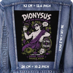 May include: A blue denim jacket featuring a large rectangular black patch on the back. The patch displays a graphic of Dionysus with text reading DIONYSUS, GOD OF WINE, CHAOS & GOOD TIMES, WINE NOT?, IN VINO VERITAS, LIFE IS SHORT. DRINK DEEP. DANCE WILD. 32 x 36 cm.