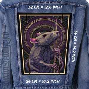 May include: A denim jacket with a large patch featuring a detailed illustration of a rat. The patch is framed with a gold border and includes measurements: 12.6 inches wide, 14.2 inches tall, and 10.2 inches long.