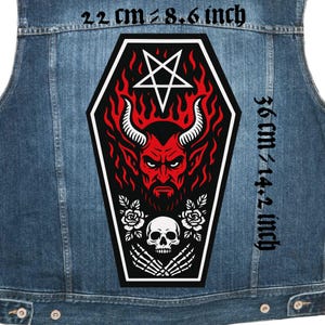 May include: A denim vest with a large, black coffin-shaped patch featuring a red devil with horns, a pentagram, and a skull. The patch measures approximately 8.6 inches wide and 14.2 inches tall.