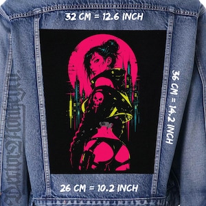 May include: A blue denim jacket featuring a large rectangular back patch with a graphic illustration of a person in a cyberpunk style against a pink moon and city skyline. The patch measures 32 cm by 36 cm, or 12.6 inches by 14.2 inches.