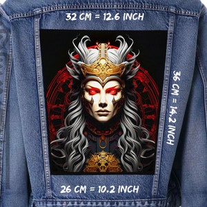 May include: A denim jacket with a black and red graphic patch featuring a woman with white hair and a crown. The patch measures 32 cm wide by 36 cm tall. The text "32 CM = 12.6 INCH", "36 CM = 14.2 INCH", and "26 CM = 10.2 INCH" is printed on the jacket.