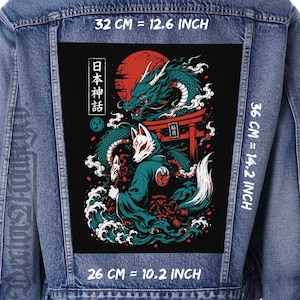 May include: A blue denim jacket featuring a large rectangular patch on the back. The patch displays a graphic of a kitsune figure and a dragon with a red sun, a torii gate, and Japanese text. Dimensions are 12.6 inches by 14.2 inches by 10.2 inches.
