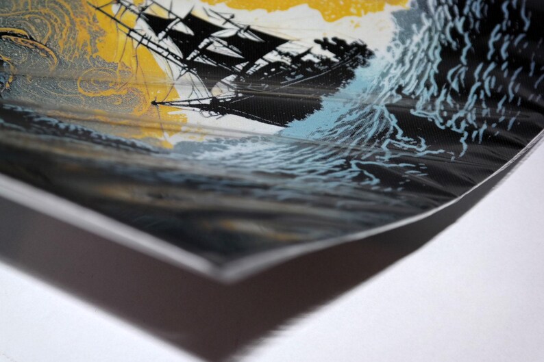 May include: A close-up of a black and white illustration of a ship sailing through stormy seas. The ship has a large sail and is surrounded by waves. The background is a yellow and blue sky.