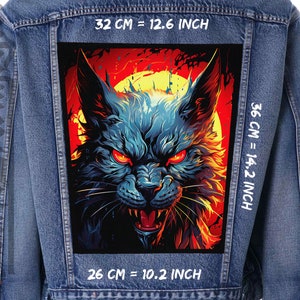 May include: A denim jacket with a patch on the back featuring a blue and black wolf with red eyes, set against a red and orange background. The patch measures 36 cm by 26 cm, or 14.2 inches by 10.2 inches.