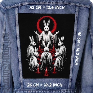 May include: A blue denim jacket featuring a large rectangular back patch with a graphic of white rabbits in robes surrounding a central figure within a red circle. The patch measures 32 cm by 36 cm, or 12.6 inches by 14.2 inches, with a 26 cm width.