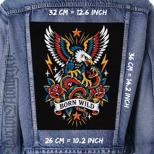May include: A blue denim jacket featuring a large rectangular back patch with a graphic of an eagle fighting a snake, surrounded by red roses, yellow lightning bolts, and stars. The text BORN WILD is printed on a banner. Dimensions are 12.6 inches wide by 14.2 inches high.