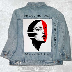May include: A black and white illustration of a woman's face with a red diagonal line across it. The illustration is printed on a white background and is 14.2 inches tall and 10.2 inches wide.