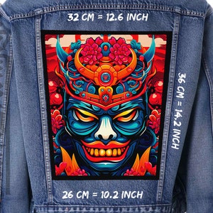 May include: A denim jacket with a colorful embroidered patch of a Japanese demon mask with red flowers and a black background. The patch is 14.2 inches tall and 10.2 inches wide.