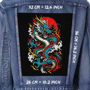 May include: A denim jacket with a large black patch featuring a detailed illustration of a teal and gold dragon with a red sun in the background. The patch measures 12.6 inches by 14.2 inches.