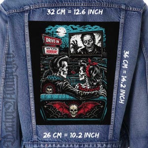 May include: A blue denim jacket featuring a large rectangular back patch with a horror drive-in movie scene. The patch shows two skeletons in a car watching a zombie on a screen. Text reads DRIVE-IN and NOW PLAYING HORROR. Dimensions are 12.6 by 14.2 inches.