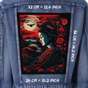 May include: A denim jacket with a black and red embroidered patch featuring a geisha with a red flower in her hair. The patch is 12.6 inches wide, 14.2 inches tall, and 10.2 inches deep. The text "32 CM = 12.6 INCH", "36 CM = 14.2 INCH", and "26 CM = 10.2 INCH" is printed on the jacket.