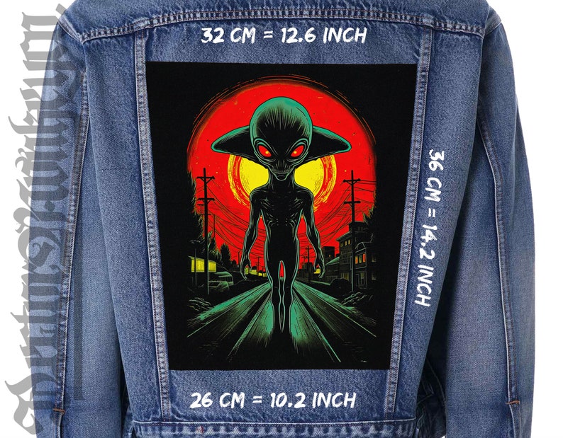 May include: A denim jacket with a black and green alien graphic patch on the back. The patch features a green alien with red eyes walking down a street with a red and yellow sunset in the background. The patch is 10.2 inches wide, 14.2 inches tall, and 12.6 inches from top to bottom.