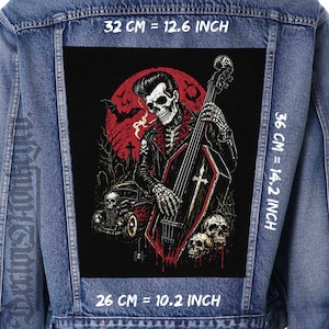 May include: A denim jacket with a large, rectangular patch featuring a skeleton playing a double bass. The patch has a red and black color scheme with a graveyard and car in the background. The patch measures 12.6 inches by 14.2 inches.