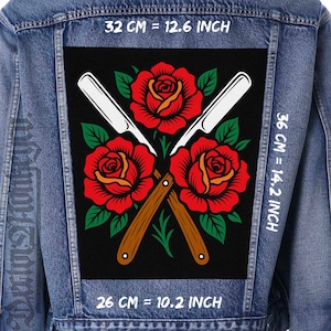 Op de afbeelding: Een zwart patch met een ontwerp van drie rode rozen met oranje centra, groene bladeren en twee gekruiste rechte scheermessen. De patch is 36 cm hoog en 32 cm breed. De onderste breedte is 26 cm.