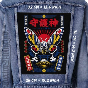 May include: A blue denim jacket featuring a large rectangular back patch with a moth illustration, a red sun, Mount Fuji, and Japanese text. The patch measures 32 cm wide by 36 cm high, with a bottom width of 26 cm.