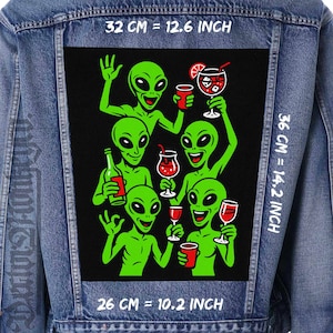 May include: A denim jacket with a large, black patch featuring green cartoon aliens toasting with drinks. The patch measures 32 cm by 36 cm and 26 cm. The aliens are holding wine glasses, cocktails, and bottles.