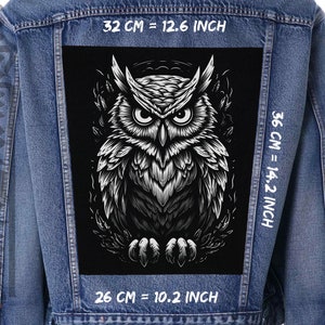 May include: A denim jacket with a large, black and white owl patch. The patch is 12.6 inches wide, 14.2 inches tall, and 10.2 inches long. The owl design features detailed feathering and piercing eyes, creating a striking contrast against the jacket.