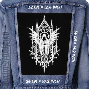May include: A black patch with a white gothic angel design, measuring 12.6 inches wide, 14.2 inches tall, and 10.2 inches long. The angel has large wings and is set against a detailed architectural background. The patch is on a denim jacket.