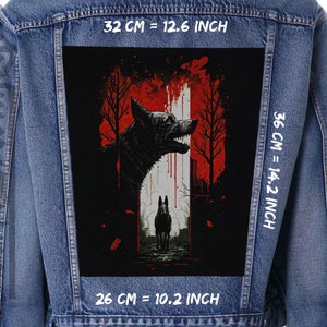 May include: A black and white illustration of two dogs in a dark forest with a red and white background. The text "32 CM = 12.6 INCH", "36 CM = 14.2 INCH", and "26 CM = 10.2 INCH" is printed on the image.