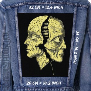 May include: A denim jacket with a large black patch featuring a yellow illustration of two human heads split apart. The patch measures 32 cm wide, 36 cm tall, and 26 cm deep.