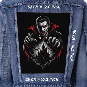 May include: A denim jacket with a large, rectangular patch featuring a vampire illustration. The vampire has red eyes and is reaching out with his hands. The patch is 14.2 inches high, 12.6 inches wide, and 10.2 inches long. The image includes a castle.