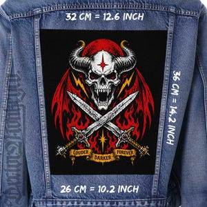 May include: A blue denim jacket featuring a large rectangular back patch with a graphic of a horned skull, red wings, and crossed swords. The patch includes the text LOUDER DARKER FOREVER and measures 12.6 inches by 14.2 inches by 10.2 inches.