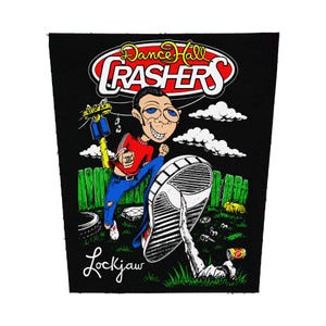 May include: Black patch featuring a cartoon illustration of a man kicking a shoe. The patch has the words "Dance Hall Crashers" in a red and white oval, and "Lockjaw" in cursive. The background includes a fence, clouds, and grass.
