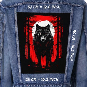 May include: A black wolf with red eyes stands in a dark forest with a red moon in the background. The image is printed on a denim jacket with white text that reads "32 CM = 12.6 INCH", "36 CM = 14.2 INCH", and "26 CM = 10.2 INCH".