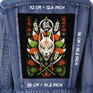 May include: A blue denim jacket featuring a large rectangular back patch with a graphic of a nine-tailed fox mask, crossed swords, and red flowers. The patch measures 32 cm by 36 cm, with text in Japanese characters throughout the design.