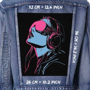 May include: A black and white illustration of a woman wearing pink and black headphones and pink sunglasses. The image is on a denim jacket with measurements in centimeters and inches.