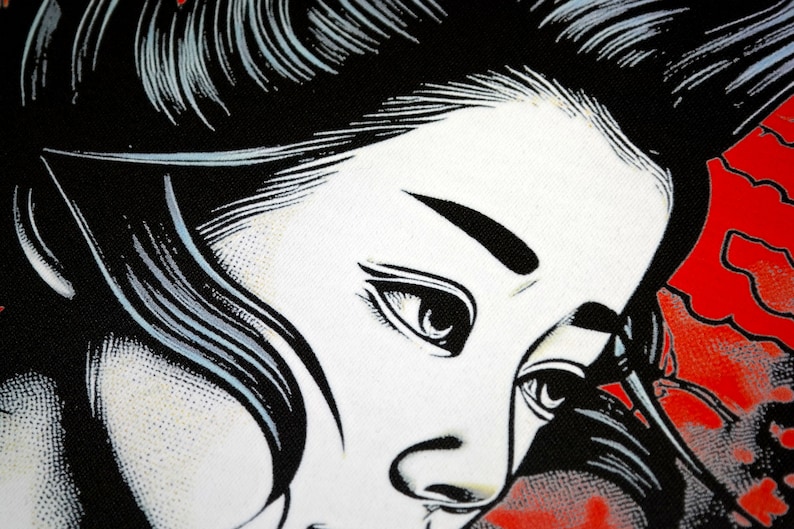 May include: A black and white illustration of a woman's face with a red background. The woman has long black hair and her eyes are closed. The background is a red and white pattern.