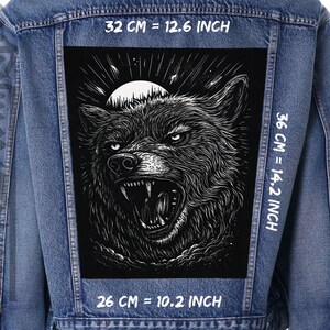 May include: A black and white illustration of a wolf howling at the moon. The wolf is surrounded by stars and clouds. The image is printed on a black fabric patch. The patch is 12.6 inches wide, 14.2 inches tall, and 10.2 inches deep.