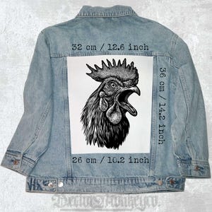 May include: A black and white illustration of a rooster's head with an open beak. The illustration is printed on a white patch and sewn onto a blue denim jacket. The patch measures 14.2 inches by 10.2 inches.